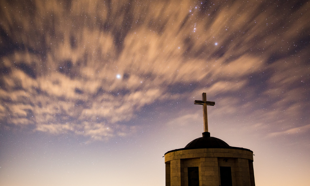 The roof of a church against the evening sky