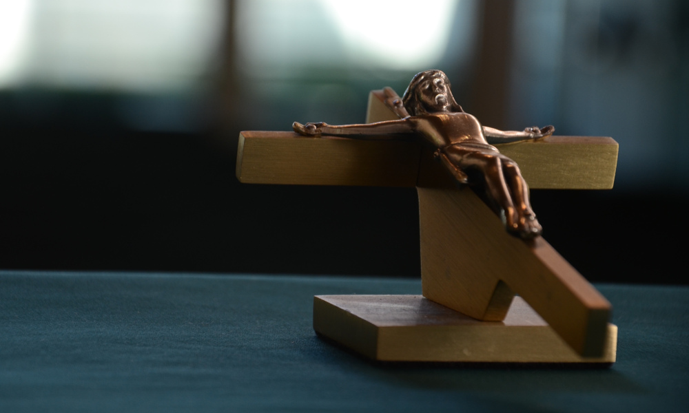 A crucifix on a desk