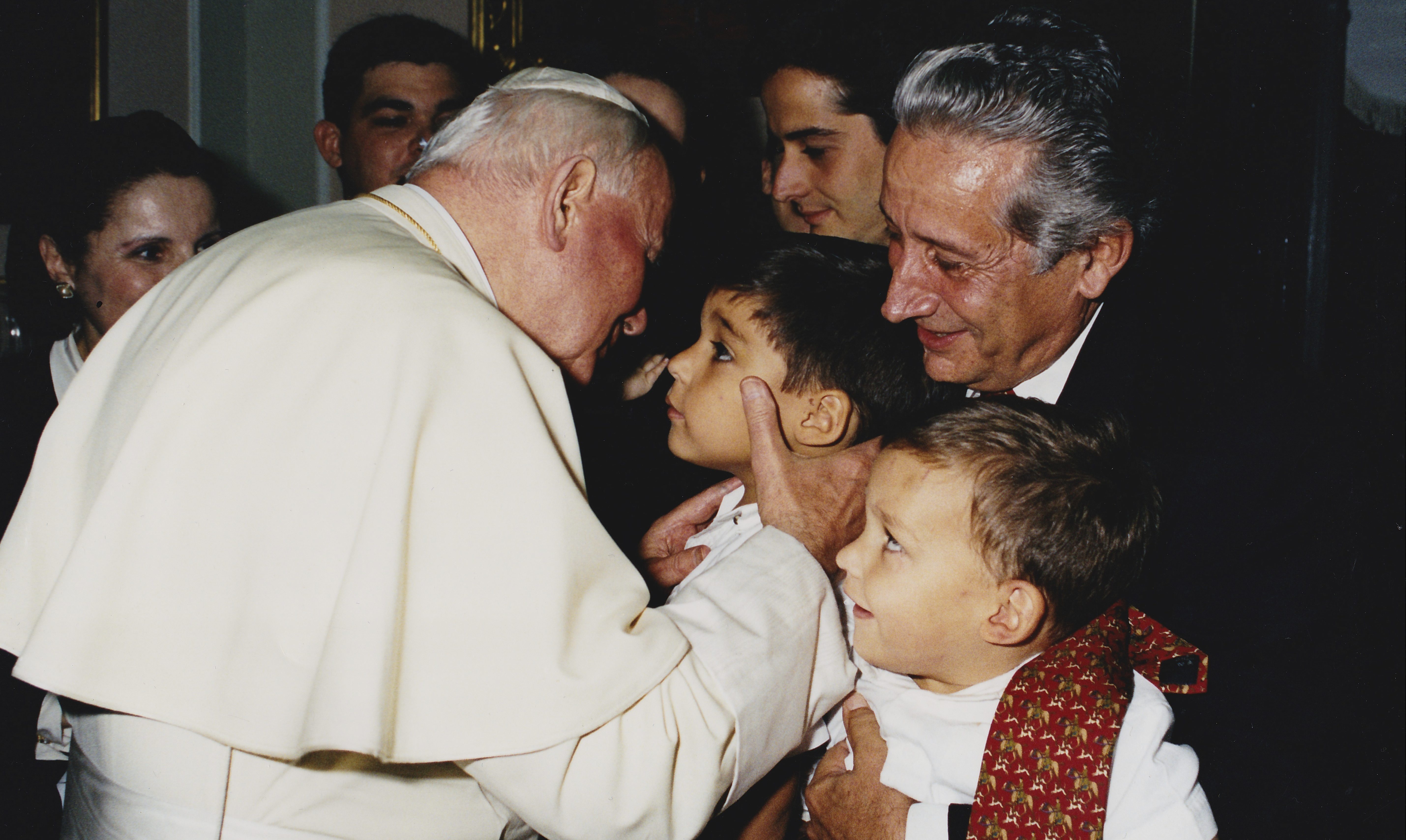 Image: Young Br. Josemaría and his family with Pope St. John Paul II.